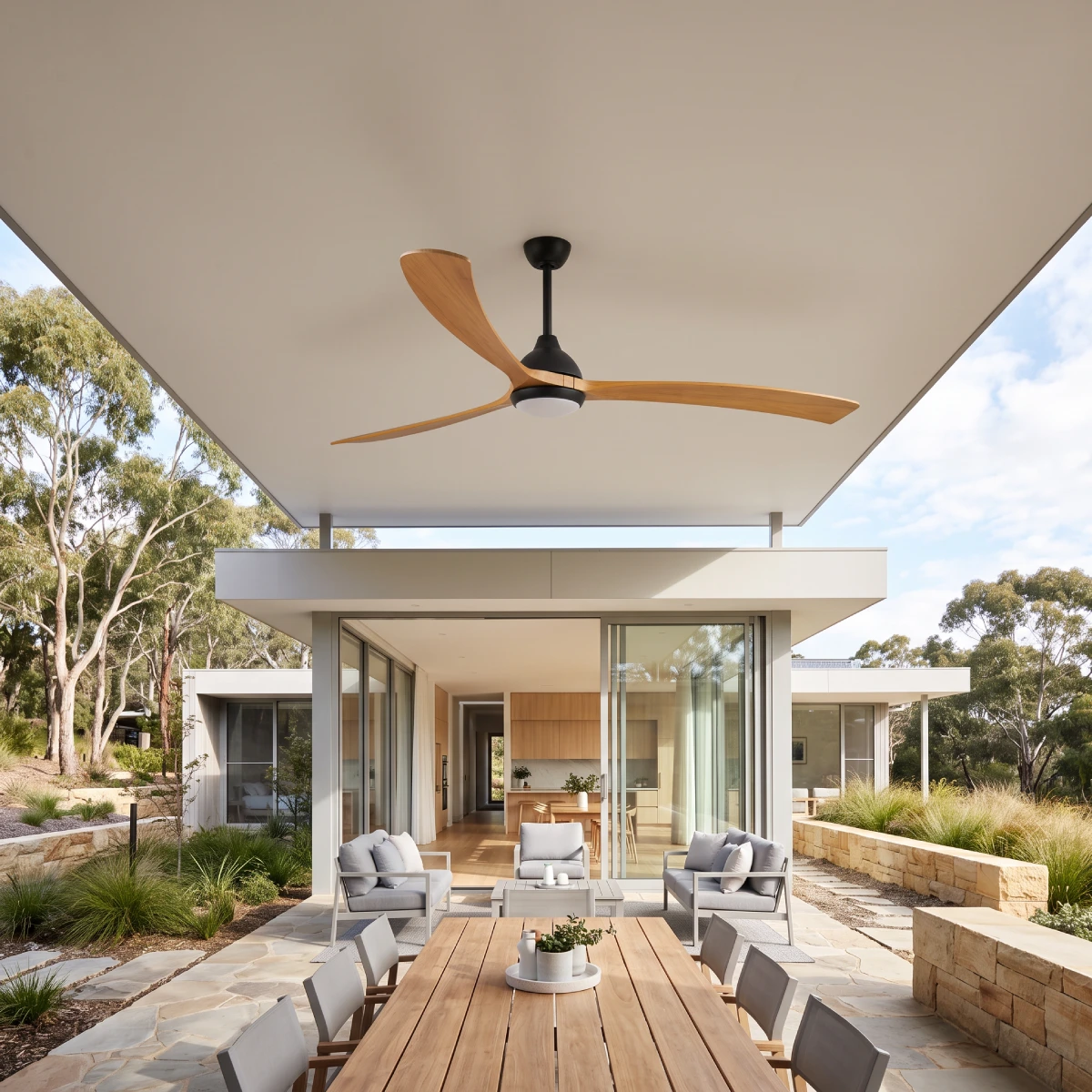 fanco-sanctuary-dc-ceiling-fan-86-inch-black-with-teak-blades-with-led-light-wide-outdoor-insitu.webp